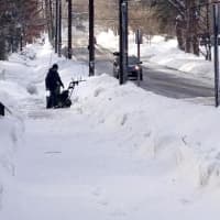 <p>A lone snowblower tackles the drifts Friday morning. </p>