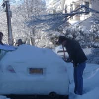 <p>A Dobbs Ferry couple digs out their car before Saturday&#x27;s expected snow.</p>