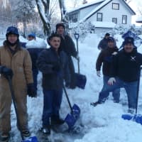 <p>Crews of workers with Donald Brown Roofing Co. in Hastings were out removing snow Friday.</p>