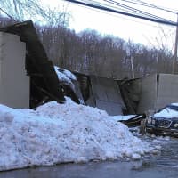 <p>A roof and walls of a garage on North Greeley Avenue collapsed during the snowstorm. </p>