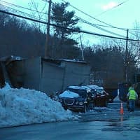 <p>Three cars inside and one outside were damaged in the collapse. </p>