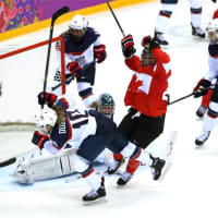 <p>Marie-Philip Poulin celebrates after scoring a goal late in regulation for Canada to force overtime in Thursday&#x27;s gold medal game against the United States.</p>