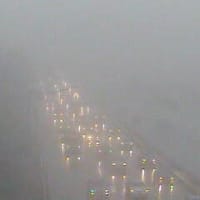 <p>The traffic can barely be seen through the fog Friday afternoon on I-95 at Lockwood Avenue in Stamford. </p>