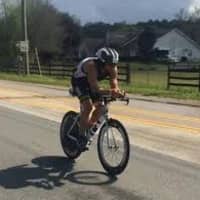 <p>Nick Logan competes on his bike in the Ultraman Florida race.</p>