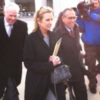 <p>Kerry Kennedy exits the Westchester County Courthouse in White Plains with her lawyers following the first day of her trial Monday.</p>