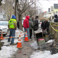<p>Neighbors in Mount Vernon eagerly observed clean up crews.</p>
