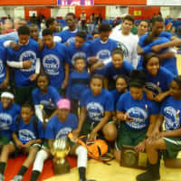 <p>The twin Section 1 champion Woodlands boy and girls teams celebrate together.</p>