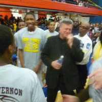 <p>Mount Vernon boys basketball coach Bob Cimmino celebrates with his Knights after winning a 15th title in 17 years at the County Center.</p>