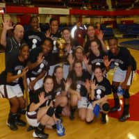 <p>The Section 1 Class AA girls champion Ossining girls basketball yeam at center court at the County Center</p>