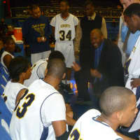 <p>Clark Academy boys basketball coach Anthony Gaines talks to his team during Tuesday&#x27;s regional semifinal at the County Center.</p>