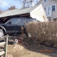 <p>A Land Rover SUV drove through a garage on Cunningham Place in Westport Thursday morning.</p>