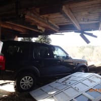 <p>A garage on Cunningham Place in Westport was deemed unstable after a SUV drove through it Thursday morning, taking out two walls.</p>