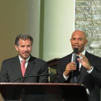 <p>Mariano Rivera presents New Rochelle City Manager Charles Strong with a Companion Bible.</p>