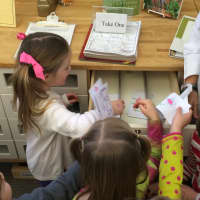 <p>Preschoolers from Fairfield&#x27;s Hill Farm Preschool put their decorated envelops into the seed library at Fairfield Woods Branch Library. </p>