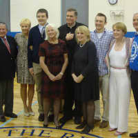 <p>The Doty Family with Monsignor Donald Dwyer,  Resurrection Church pastor, celebrate the opening of the new gym at the Resurrection School in Rye.</p>