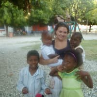 <p>Wilton&#x27;s Cassidy Stack poses with children at the New Life Children&#x27;s Home in Haiti in 2011. She and mom Patti are traveling back to the orphanage on March 15.</p>