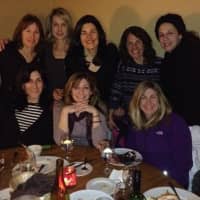<p>Laura Mogil and friends enjoy a dinner during a girls weekend away in Vermont.</p>
