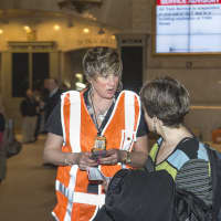 <p>A Metro-North worker gives out information at Grand Central Terminal after train service was shut down. </p>