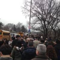 <p>People are lined up and waiting for buses and trains at the Woodlawn Station in the Bronx, N.Y.
</p>