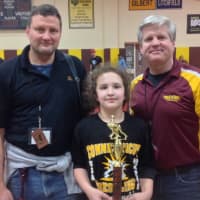 <p>Norwalk Mad Bulls wrestler Anna Haus won a state title on Sunday. She is with her father Randy, left, and Art Schad, her coaches with the Norwalk Mad Bulls.</p>