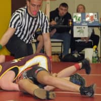 <p>Madeleine Gordon of the Norwalk Mad Bulls tries to pin her opponent.</p>