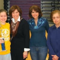 <p>Meghan Lavelle, left,  of Tibbetts, Keating &amp; Butler won the Allyson Rioux Sportsmanship Award. She is with members of the Rioux family.</p>