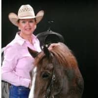 <p>Realtor Gloria Marwell stands with her horse, Bet On Pink.</p>