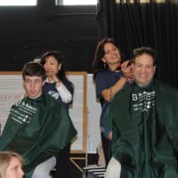 <p>Dozens of people attend last year&#x27;s St. Baldrick&#x27;s head shaving event at Osborn Hill School to support families who have lost children in Fairfield. </p>