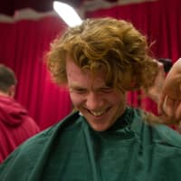 <p>Fairfield Warde High School senior Brian Kerrigan gets his head shaved during Stratfield School&#x27;s St. Baldrick&#x27;s event.</p>