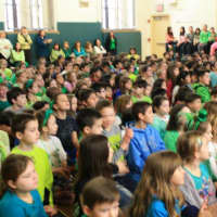 <p>A captivated audience of students, parents and teachers look on in Eastchester.</p>