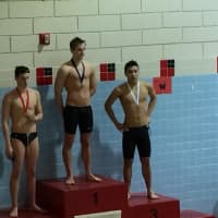 <p>Wilton Wahoosswimmer Stephen Holmquist receives his gold medal after winning and setting a new pool record at Wesleyan University Pool in the 400 individual medley.</p>