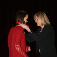 <p>A winner receives her award from state Rep. Kim Fawcett.</p>