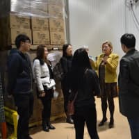 <p>Chinese college students, who were winners of a PepsiCo contest, visit Food Bank for Westchester. </p>