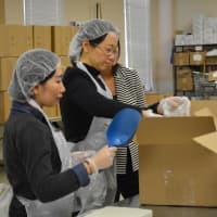 <p>The students repacked food for distribution. </p>