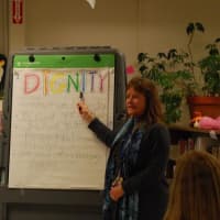 <p>School social worker Joann Fenton helps students understand the definition of dignity.</p>