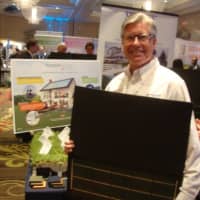 <p>Michael Murphy of Murphy Brothers Contracting shows off a solar panel at the Westchester Business Expo in Rye Brook.</p>