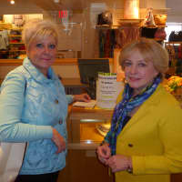 <p>Talbots Sales Associate Cindy Minisci, right, tells customer Jill Notarpole, left, about their 35th anniversary celebration April 5. </p>