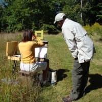 <p>Painter Dmitri Wright works with a student painting en plein air at Weir Farm National Historic Site.</p>