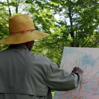 <p>Dmitri Wright paints en plein air at Weir Farm National Historic Site in Wilton and Ridgefield.</p>