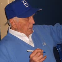<p>Dodger great Carl Erskine signing autographs at the March Madness Card Show at the Westchester County Center</p>