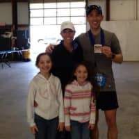 <p>Norwalk&#x27;s James Whipple stands with his wife, Shannon, and daughters after winning Saturday&#x27;s 50-mile ultramarathon in New Jersey.</p>