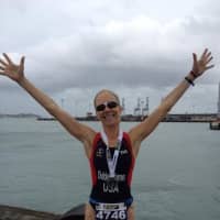 <p>Greenwich&#x27;s Katha Diddel-Warren celebrates after competing in the World Triathlon Championships in New Zealand in 2012. She died Tuesday at the age of 56.</p>