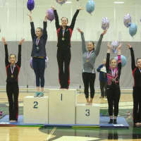 <p>Ridgefield&#x27;s Erika Marr stands on the top step of the podium after winning the Level 9 14-15 age group All-Around title at the U.S. Gymnastics Connecticut State Championships.</p>