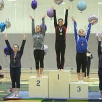 <p>Westport&#x27;s Pam Onorato stands on the top step of the podium after winning the Level 9 16-and-up All-Around title at the U.S. Gymnastics Connecticut State Championships.</p>