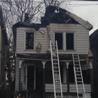 <p>Shortly after firefighters arrive at the scene of a three-alarm house fire on 94 State Street in Ossining on Friday, there was a partial roof collapse.</p>