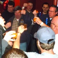 <p>Hastings DPW staffers toast their friend and co-worker Rocky Tollefsen, center, on his retirement.</p>