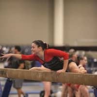 <p>Westport&#x27;s Pam Onorato competes on the balance beam.</p>