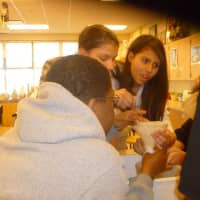 <p>Students in the club take part in an exercise to see how chemicals can pollute the Hudson.</p>