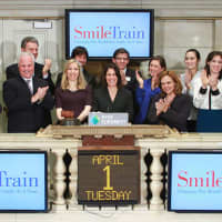 <p>Westport resident Johanna Rossi  joins Smile Train CEO Susannah Schaefer, staff and supporters at the New York Stock Exchange on Tuesday.</p>