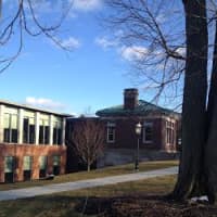 <p>Visitors to the newly expanded Ridgefield Library, which reopens next month, will enter through the historic EW Morris Building with the green roof. </p>